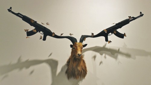 asylum-art-2:   Peter Peter Gronquist’s Taxidermy Gun Antlers  Peter Gronquist makes the  unlikely combination of taxidermy and symbols of power and luxury.  Taking the traditional forms of taxidermy, Peter creates gold and silver  antlers for the stuffed