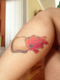 fuckyeahtattoos:  This is my first one. It’s Pudge the Fish from the Lilo and Stitch movie. He controls the weather. Done by Mike at the Blue Heron in Derry, NH.