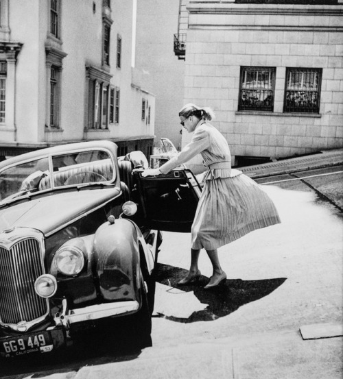 “Anne with Riley, parking on the steep hill just below the Mark Hopkins Hotel. Circa 1950s.” Photogr