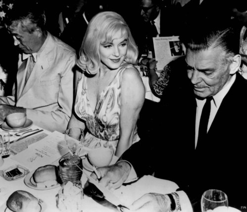 Director John Huston, Marilyn and Actor Clark Gable at the Mapes Hotel on August 5th 1960. 