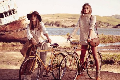 Young fashion models, old scrappy bicycles