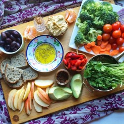 happyvibes-healthylives:  Had myself a random smorgasbord dinner- apples, oranges, olives, roasted peppers, avocado, hummus, garlic confit, fresh herbs, ️raw veggies, fresh bakery bread and olive oil w/herbs to dip. 