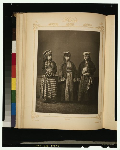 Studio portraits of models wearing traditional clothing from theOttoman province of Koniah, also kno