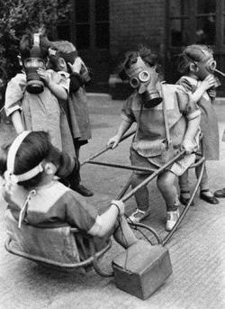  Children wearing gas masks while playing,