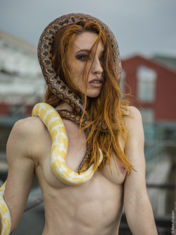 benhopper:  Circus artist Katrina Lilwall photographed on the roof of my building, with a couple of her snakes. 