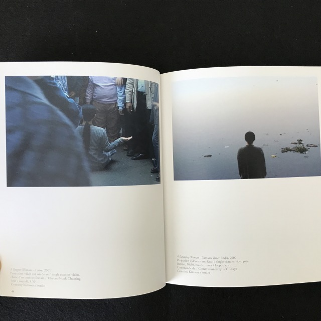 Page spread. Both images show the back of the artist. Left image shows her in front of the body of water. Right image shows her sitting on the ground.