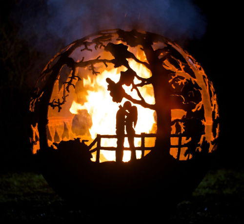 asylum-art:  iBeautiful Metal Firepits Of Art by The Firepit Company  The Wilderness Ball This Firepit features a wilderness scene. Including Stag, Doe and Fawn, Wolf, Moose, Swan and a flock of Geese flying accross the skyline.