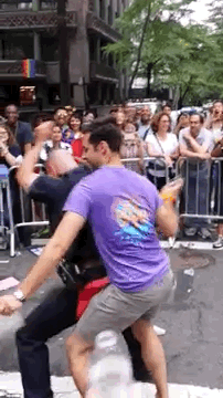buzzfeed:  A Hot Cop Got Down At NY PrideThe purple-shirted dancer, Aaron Santis,