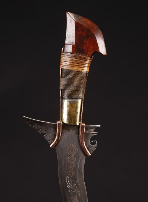 art-of-swords:  Moro Kris Sword  Dated: 19th century Geography: Southern Philippines Measurements: overall length 27" (68.58cm); blade length 21" (53.34cm) The handle has a burl wood pommel, and a variety of wrappings of rattan and twine. The