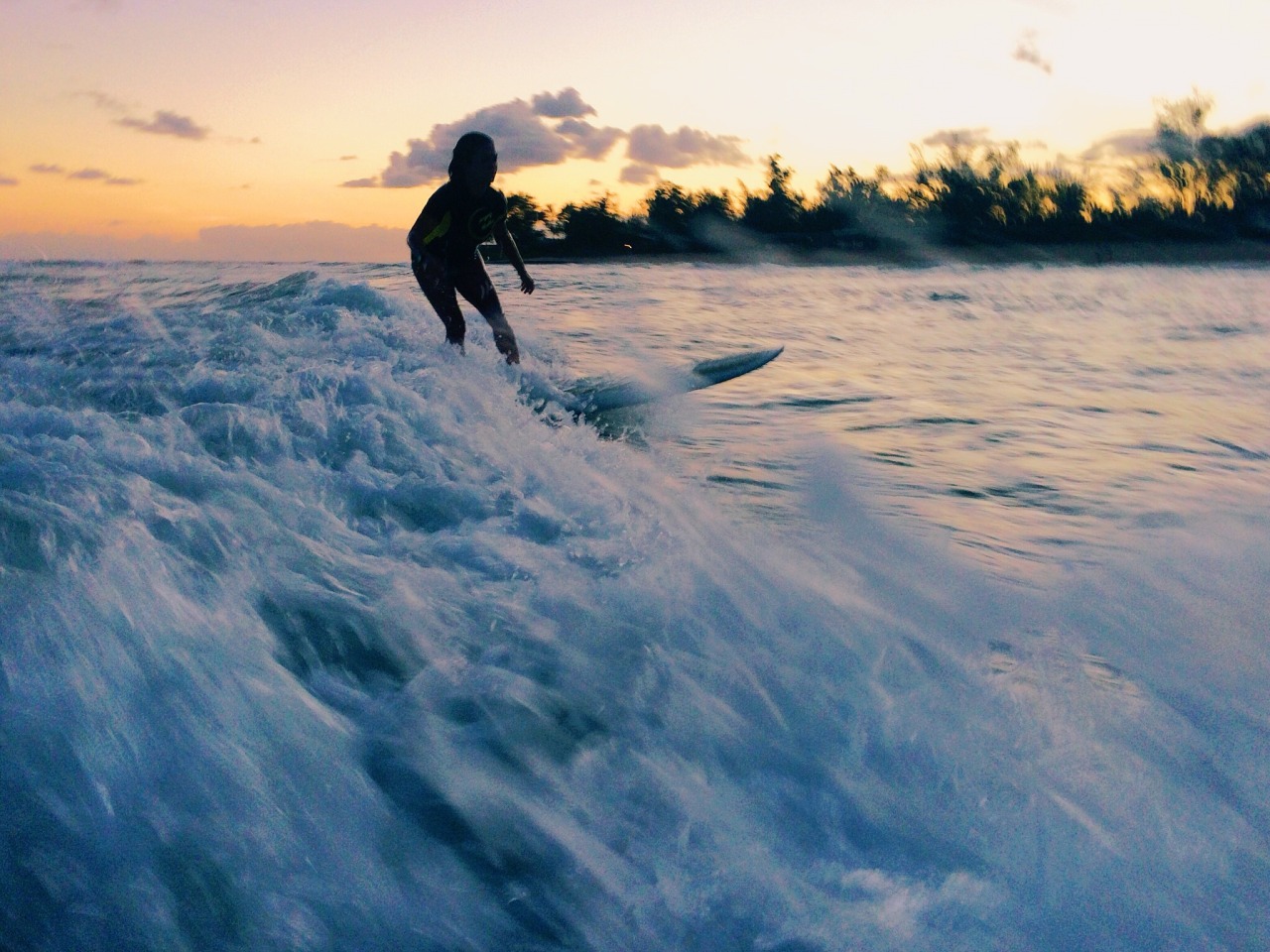 caseykaui:  sister and i surfing awhile ago