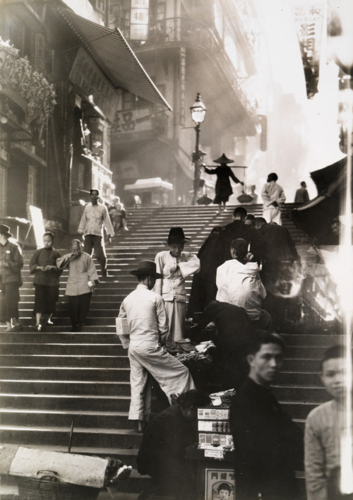 undr:

W. Robert Moore. Vendors and pedestrians along a steep...