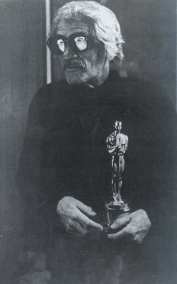 chainedandperfumed:  Luis Buñuel with his Academy Award for The Discreet Charm of the Bourgeoisie. 1973. 