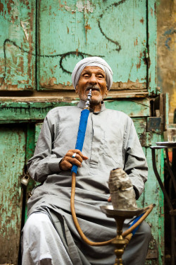  Elderly Egyptian at a street-side cafe in