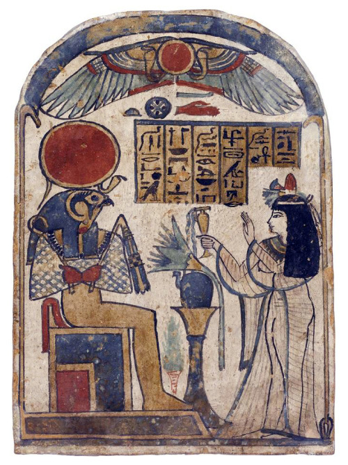 Stela of wood covered with gesso and painted, showing the Housemistress Ta-ka-sab worshipping Ra-Hor