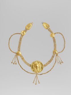 ancientpeoples:  Gold hormos with medallion  A hormos was a collar that could be worn on clothes. This hormos is made from gold and the medallion in the middle shows the god Dionysus. It is from the south of Italy, the Terentine culture.  Greek, Early