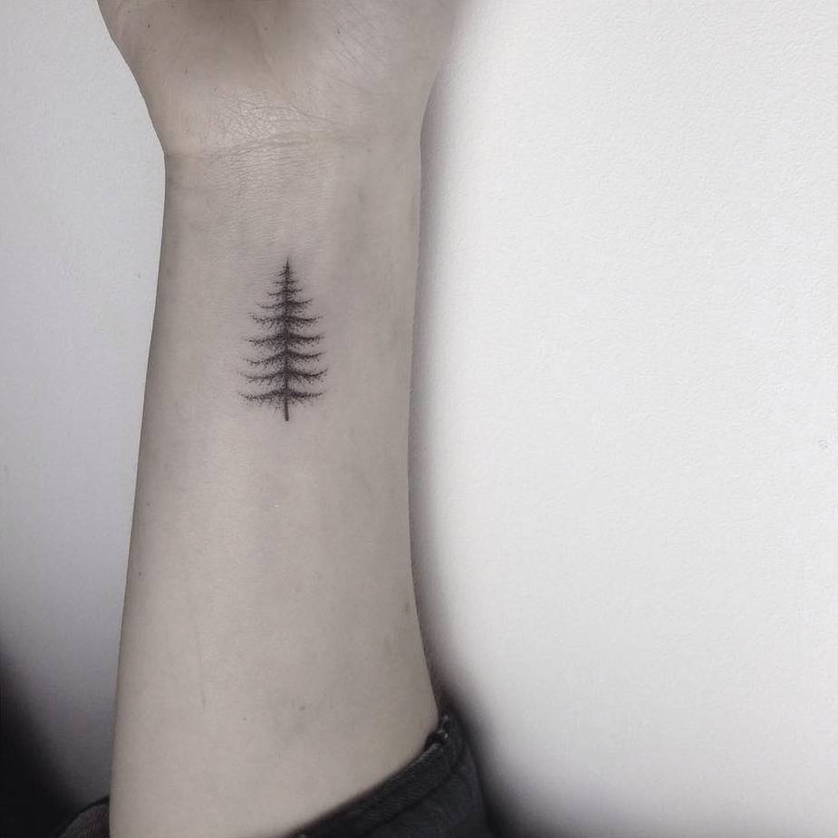Little Tattoos — Hand poked small pine tree tattoo on the left...