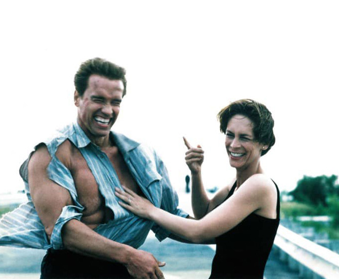 Machete Landing — Arnold Schwarzenegger & Jamie Lee Curtis on the...