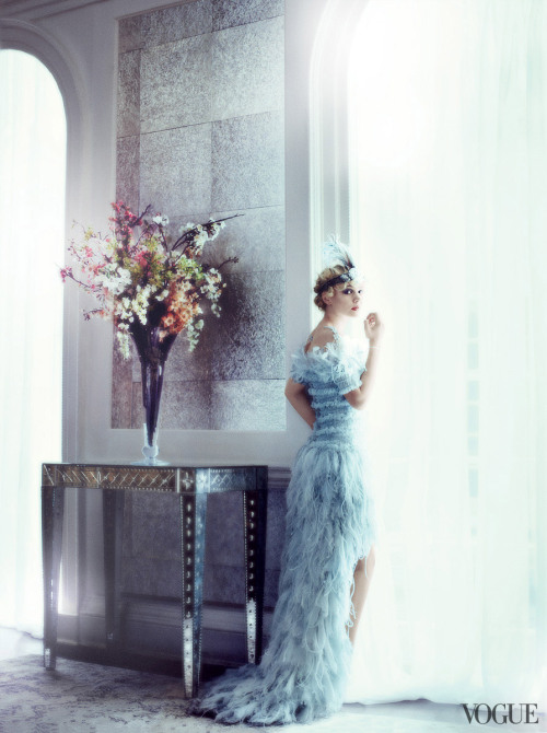    Carey Mulligan in Chanel Haute Couture chiffon, feather, and tulle dress with flouncing open shoulders. Twenties headband from New York Vintage. Photographed by Mario Testino See the slideshow 