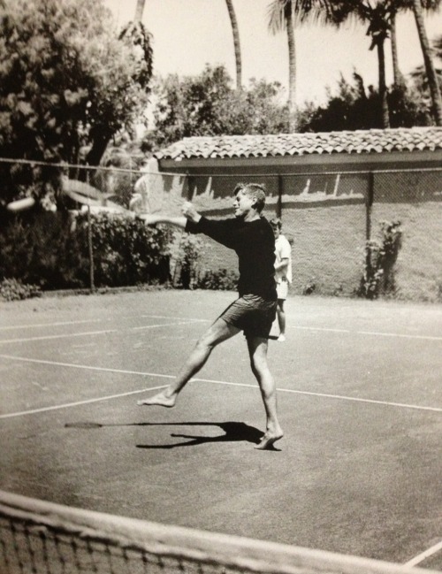 john-f-kennedy-and-his-family:americas-royalty:JFK playing some tennisWith Bobby..in Palm Beach