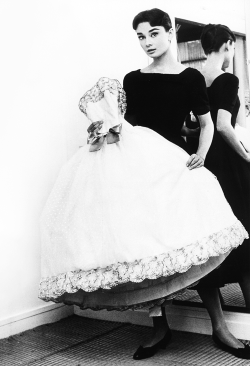 vintagegal:  Audrey Hepburn holding the Givenchy white point d’esprit ball gown from the film Love in the Afternoon (1957) 