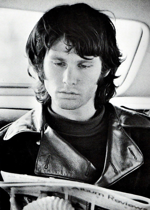 babeimgonnaleaveu:  Jim Morrison reading album reviews in the back of a car. 