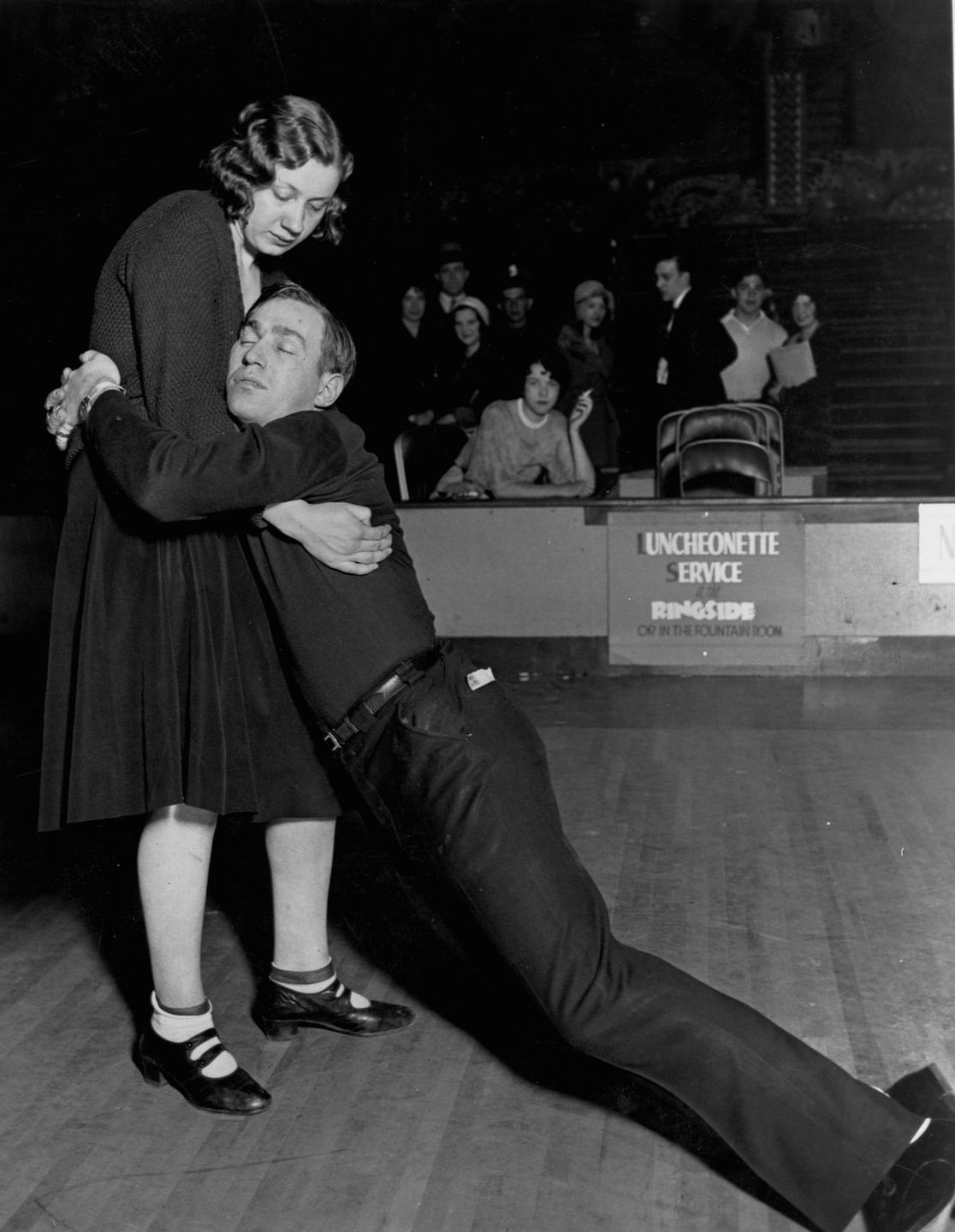 historicaltimes: Woman Struggles to Support Her Exhausted Partner During a Dance