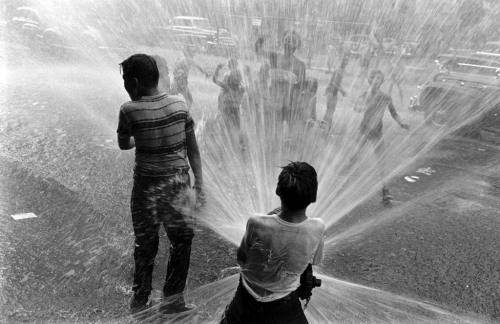 newyorkthegoldenage:  Young New Yorkers’ favorite summertime activity, playing in the spray from a fire hydrant, 1953.Photo: Peter Stackpole for Life magazine