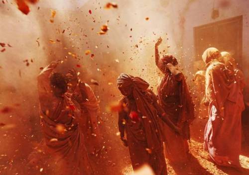 secretdiaryofapashtungirl:Widows daubed in colours dance as they take part in the Holi celebrations 