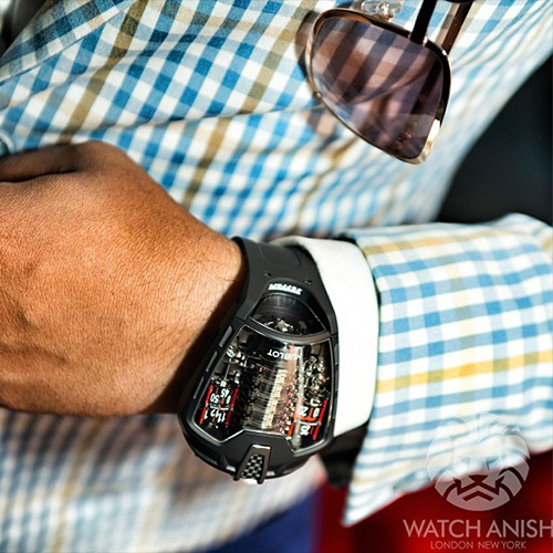 watchanish:  50 day power reserve, 11 barrels, vertical tourbillon and 217 mph. The Hublot LaFerrari 
