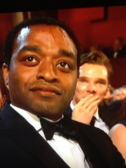 extremelysherlocked:  Chiwetel Ejiofor and Benedict Cumberbatch during Lupita Nyong’os speech 