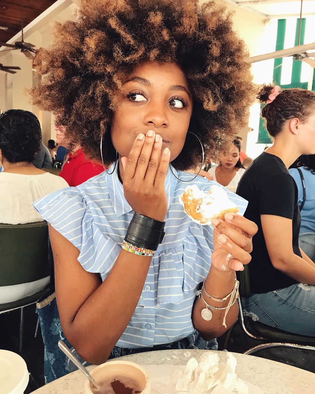 first-time-trying-beignets-appreciating-every-bite-only-interested-in