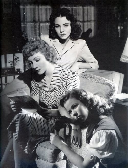Claudette Colbert, Jennifer Jones, and Shirley Temple read letters in Since You Went Away (1944). Th