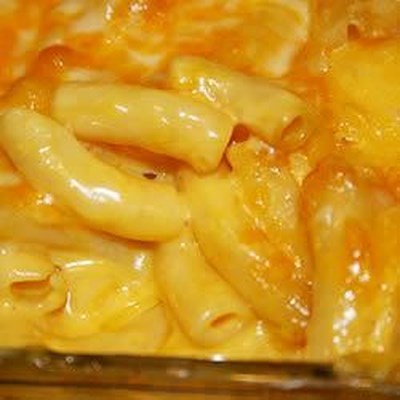Macaroni is combined with canned cheese soup, topped with shredded Colby cheese and baked.