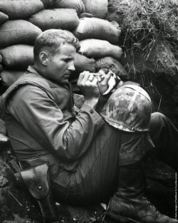 historicaltimes:  A US Marine feeds an orphan kitten found after a heavy mortar barrage near  during the Korean War, 1953 via reddit