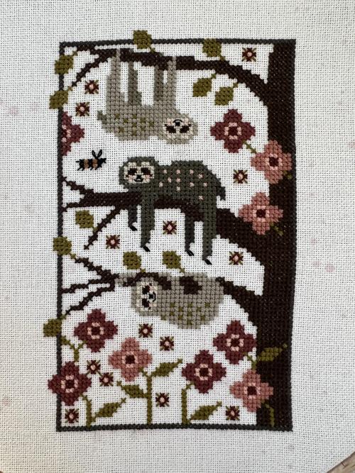 crossstitchworld:  I’m the middle sloth (Tired Trio by Plum Street Samplers) by  umichsteph