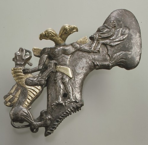 historyfilia:Shaft-hole axe head with bird-headed demon, boar, and dragon Bactria-Margiana Archaeolo