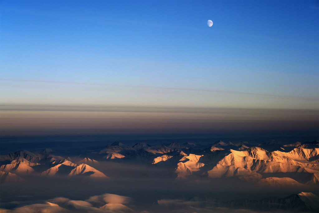 Moon over northeast Greenland by NASA Goddard Photo and Video
