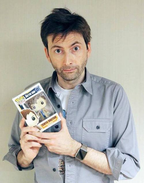 tennydr10confidential: David Tennant being adorkably playful posing with toys.