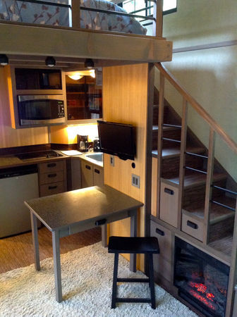 coacalin:  micromanor:  Hand Built Luxury Tiny House has Fireplace built into stairs