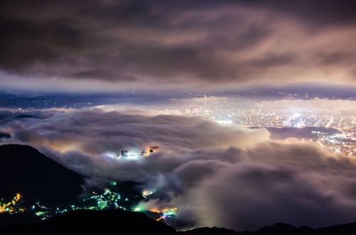 astoryforsupper:  nubbsgalore:  taipei glows under a blanket fog in these photos by wang wei zheng. (see also: dubai)  i want to print all of these on a ginormous blanket and wrap it around myself at all times because they’re so beautiful 