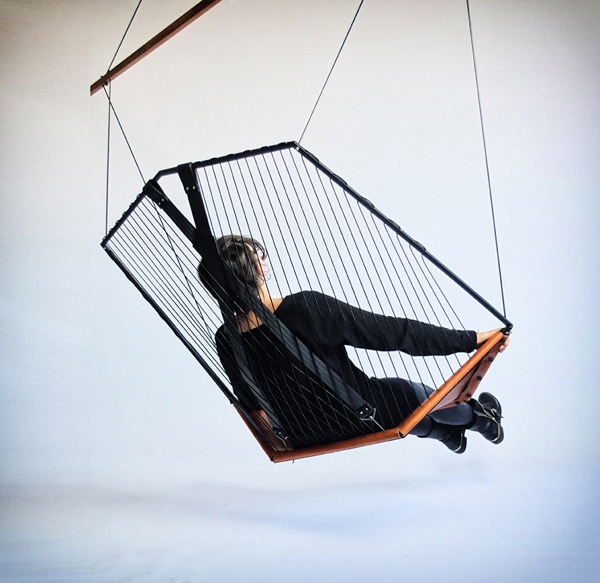 worclip:  Hanging Chair by Félix Guyon Materials: steel, leather  This chair is
