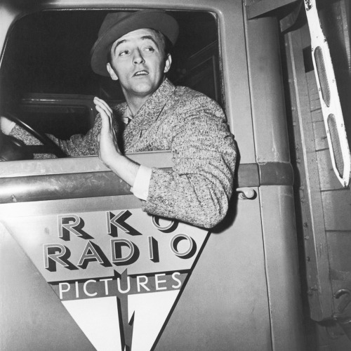 tcm:Honk honk! Robert Mitchum driving a RKO Transportation department truck on set of OUT OF THE PAS