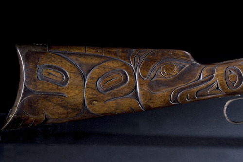 Winchester Model 1894 lever action rifle with carvings by the Tlingit people, Pacific Northwest, lat