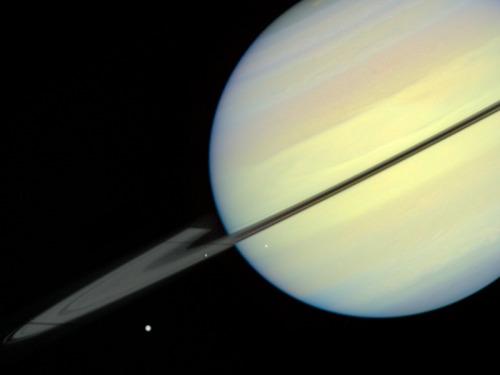 humanoidhistory:The planet Saturn and moons, observed by the Hubble Space Telescope in 1995.(HubbleS