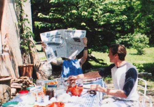 Boyfriends eating breakfast together and discussing the news