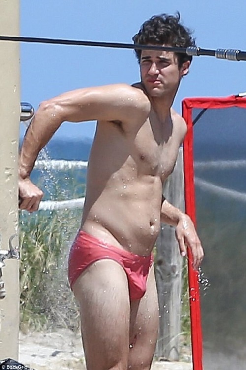 celebritybodybuge:  Darren Criss Part 1 Darren Criss in a red speedo as Andrew Cunanan on the set of The Assassination of Gianni Versace; American Crime Story.