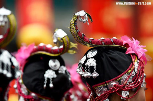 Performers wear headwear of She ethnic group during a local cultural festival in Fuan, Southeast Chi