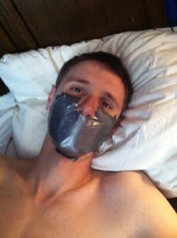 leatherbondagelove:  simplekink:  TAPE GAGGED spent most of the day in a gag.  The only appropriate way to make a tape gag :) 