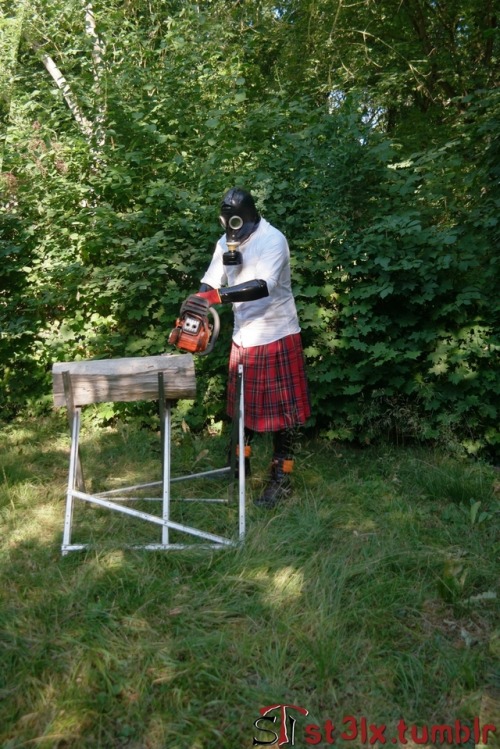 The Rubber Highland Games 2018 - Part 3 of 7Rubbered husband cutting wood in the garden