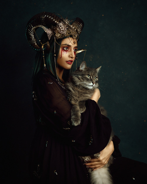 Halloween night…Self portrait with special guest Coco. Super quick shoot, little floof is not